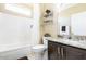 Well-lit bathroom featuring tile flooring, a shower, and a combination tub, offering comfort and style at 16416 W Rock Springs Ln, Surprise, AZ 85374