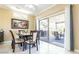 Bright dining area featuring a table with seating for six and sliding glass doors leading to the outdoor patio at 16416 W Rock Springs Ln, Surprise, AZ 85374