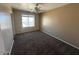 Comfortable bedroom with carpeted floors and window at 17345 N Costa Brava Ave, Maricopa, AZ 85139