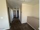 Upstairs hallway leading to bedrooms, featuring neutral paint and carpet throughout at 17345 N Costa Brava Ave, Maricopa, AZ 85139