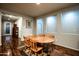 Dining room featuring wood floors, natural light and an oval wood table at 17507 W Fetlock Trl, Surprise, AZ 85387