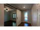 Welcoming foyer featuring hardwood floors, decorative glass front door and a modern sliding barn door at 17507 W Fetlock Trl, Surprise, AZ 85387