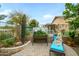 Back patio featuring a pergola, seating area, desert landscaping, and raised planter beds at 17553 N Thornberry Dr, Surprise, AZ 85374