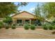 View of the backyard with mature landscaping, an upper patio, and a perimeter fence at 17553 N Thornberry Dr, Surprise, AZ 85374