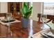 Close-up of dining table setting showcasing glassware, decorative plants, and natural wood accents at 17553 N Thornberry Dr, Surprise, AZ 85374