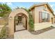 Close up shot of decorative entry gate with vine detailing in the courtyard at 17553 N Thornberry Dr, Surprise, AZ 85374