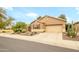 Charming single-story home featuring a desert landscaped front yard and two car garage at 17553 N Thornberry Dr, Surprise, AZ 85374