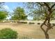 Picturesque view of the golf course with mature trees from the backyard at 17553 N Thornberry Dr, Surprise, AZ 85374