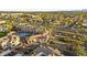 Community shot highlighting a pool, attractive landscaping, palm trees, and building architecture at 1941 S Pierpont Dr # 1013, Mesa, AZ 85206