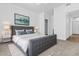 Stylishly furnished bedroom features a grey bed, contemporary art, and neutral carpet at 1941 S Pierpont Dr # 1013, Mesa, AZ 85206