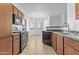 Modern kitchen offers ample counter space, wood cabinets, and is open to the dining area at 1941 S Pierpont Dr # 1013, Mesa, AZ 85206