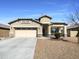 Charming single-story home with a two-car garage and desert landscaping at 20033 N Herbert Ave, Maricopa, AZ 85138