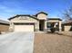 Charming single-story home with a two-car garage and desert landscaping at 20033 N Herbert Ave, Maricopa, AZ 85138