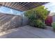 This home features a backyard patio with concrete pavers and lush citrus trees at 2212 W Claremont St, Phoenix, AZ 85015