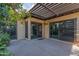 The backyard has a covered patio with concrete pavers and mature landscaping including an orange tree at 2212 W Claremont St, Phoenix, AZ 85015