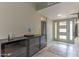 Inviting entryway with tile flooring, a decorative rug, and a stylish coat rack at 2212 W Claremont St, Phoenix, AZ 85015