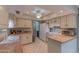 Bright kitchen featuring butcher block countertops, white cabinets, and tile floors at 2212 W Claremont St, Phoenix, AZ 85015