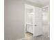 View of the carpeted bedroom through doorway with ensuite bathroom at 2315 W Pearce Rd, Phoenix, AZ 85041