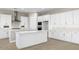 Stylish white kitchen with stainless steel hood and plenty of counter space at 2315 W Pearce Rd, Phoenix, AZ 85041