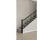 Carpeted staircase with contemporary black metal railing at 2315 W Pearce Rd, Phoenix, AZ 85041