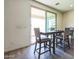 Dining area with a dark wood table and chairs near a sliding glass door offering outdoor views at 23689 W Watkins St, Buckeye, AZ 85326