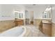 Large bathroom featuring a soaking tub and separate vanities at 2428 E Iris Dr, Chandler, AZ 85286