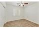 Bedroom featuring modern flooring, white walls, and bright natural light at 2428 E Iris Dr, Chandler, AZ 85286