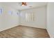 Bedroom featuring modern flooring, white walls, and bright natural light at 2428 E Iris Dr, Chandler, AZ 85286