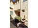 View of the front door framed by a charming water fountain and desert landscaping at 2428 E Iris Dr, Chandler, AZ 85286