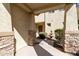 Inviting entryway with stone columns and a charming water fountain feature at 2428 E Iris Dr, Chandler, AZ 85286