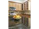 Close-up on kitchen featuring granite countertops, stainless steel appliances, wood cabinets, and tile backsplash at 2428 E Iris Dr, Chandler, AZ 85286