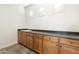 A bright and clean laundry room featuring sleek countertops, a sink, and ample storage space at 2428 E Iris Dr, Chandler, AZ 85286