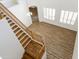 Bright living room with wood floors, staircase, and natural light from white shuttered windows at 2428 E Iris Dr, Chandler, AZ 85286