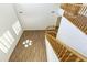 Bright living room with high ceilings, wood floors, staircase, and white shuttered windows at 2428 E Iris Dr, Chandler, AZ 85286