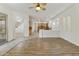 Open floor plan featuring wood floors connecting the kitchen, living, and dining areas with natural light at 2428 E Iris Dr, Chandler, AZ 85286