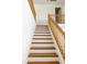 Staircase with wood steps and white risers, leading to the upper level at 2428 E Iris Dr, Chandler, AZ 85286