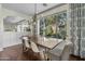 Well-lit dining room with a large window and stylish light fixture above a wooden table at 2626 E Valencia St, Gilbert, AZ 85296