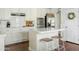 Bright white kitchen featuring subway tile backsplash, stainless steel appliances, and a stylish island at 2626 E Valencia St, Gilbert, AZ 85296