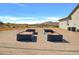 The backyard features a graveled area with custom planting boxes, a desert view, and a home in Arizona at 2775 S Baker Dr, Apache Junction, AZ 85119