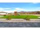 Beautiful backyard with a playground, well-maintained artificial grass, and a great mountain view at 2775 S Baker Dr, Apache Junction, AZ 85119