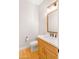 Stylish bathroom with a wooden vanity, marble countertop, and modern fixtures at 2775 S Baker Dr, Apache Junction, AZ 85119