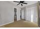 Spacious bedroom with plush carpet, an open layout, and a view into the attached bathroom at 2775 S Baker Dr, Apache Junction, AZ 85119