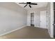 Bedroom with neutral walls, carpet, walk-in closet, and access to a bathroom at 2775 S Baker Dr, Apache Junction, AZ 85119