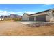 A three car garage and desert landscaping highlight the exterior of this beautiful home in Arizona at 2775 S Baker Dr, Apache Junction, AZ 85119