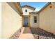 Inviting front entrance with a walkway, desert landscaping, and a modern door at 2775 S Baker Dr, Apache Junction, AZ 85119