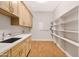 Bright laundry room with modern cabinetry and shelving at 2775 S Baker Dr, Apache Junction, AZ 85119