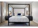 A view of the main bedroom with a decorative canopy bed and side tables with lamps at 2775 S Baker Dr, Apache Junction, AZ 85119