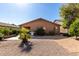 A cozy backyard with lush landscaping, a paved patio, and a barbecue grill for outdoor entertaining at 2798 W William Ln, San Tan Valley, AZ 85144