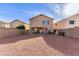 Exterior view of home featuring a covered patio, outdoor seating and low maintenance backyard at 28549 N Dolomite Ln, San Tan Valley, AZ 85143