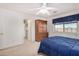 Serene bedroom showcasing a large bed, closet, and natural light at 2900 E Paloma Rd, Eloy, AZ 85131